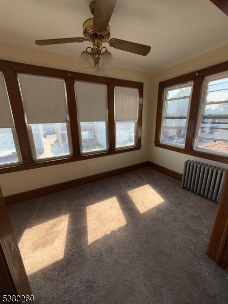 313 Ashton Avenue, Unit 2 Linden, NJ 07036 - Photo 1 of 8 a view of an empty room with a window
