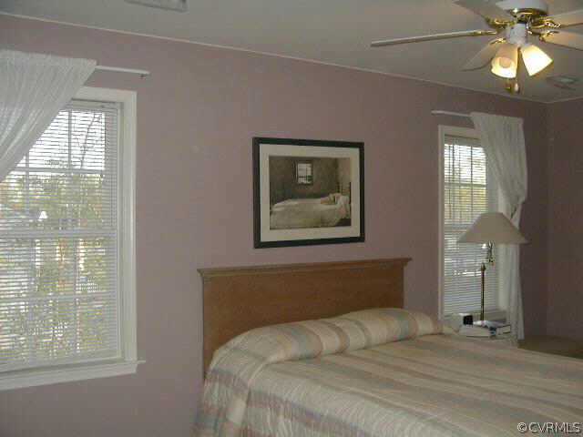 11300 Clear Ridge Drive Midlothian, VA 23112 - Photo 7 of 9 a bedroom with a bed and a window