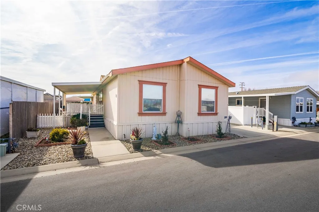 600 South Dennison, Unit 13 Tehachapi, CA 93561 - Photo 1 of 1 a front view of a house with yard outdoor seating and barbeque oven