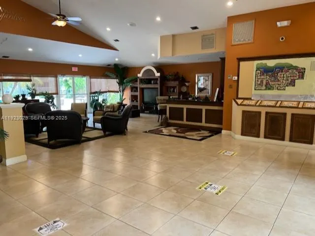 a large kitchen with a large counter and stainless steel appliances
