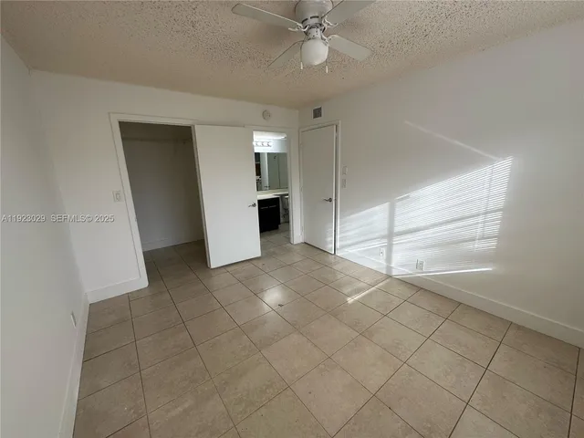 an empty room with entrance and door