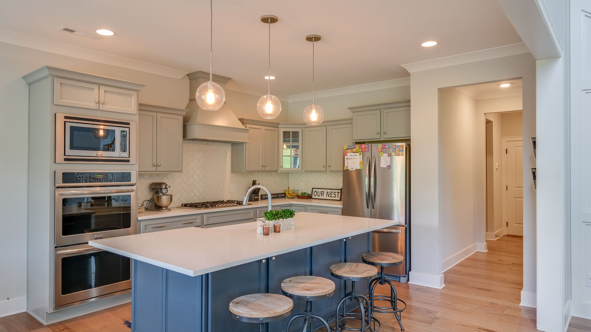 779 Plowson Road Mount Juliet, TN 37122 - Photo 11 of 44 a kitchen with a sink a stove a oven a dining table and chairs