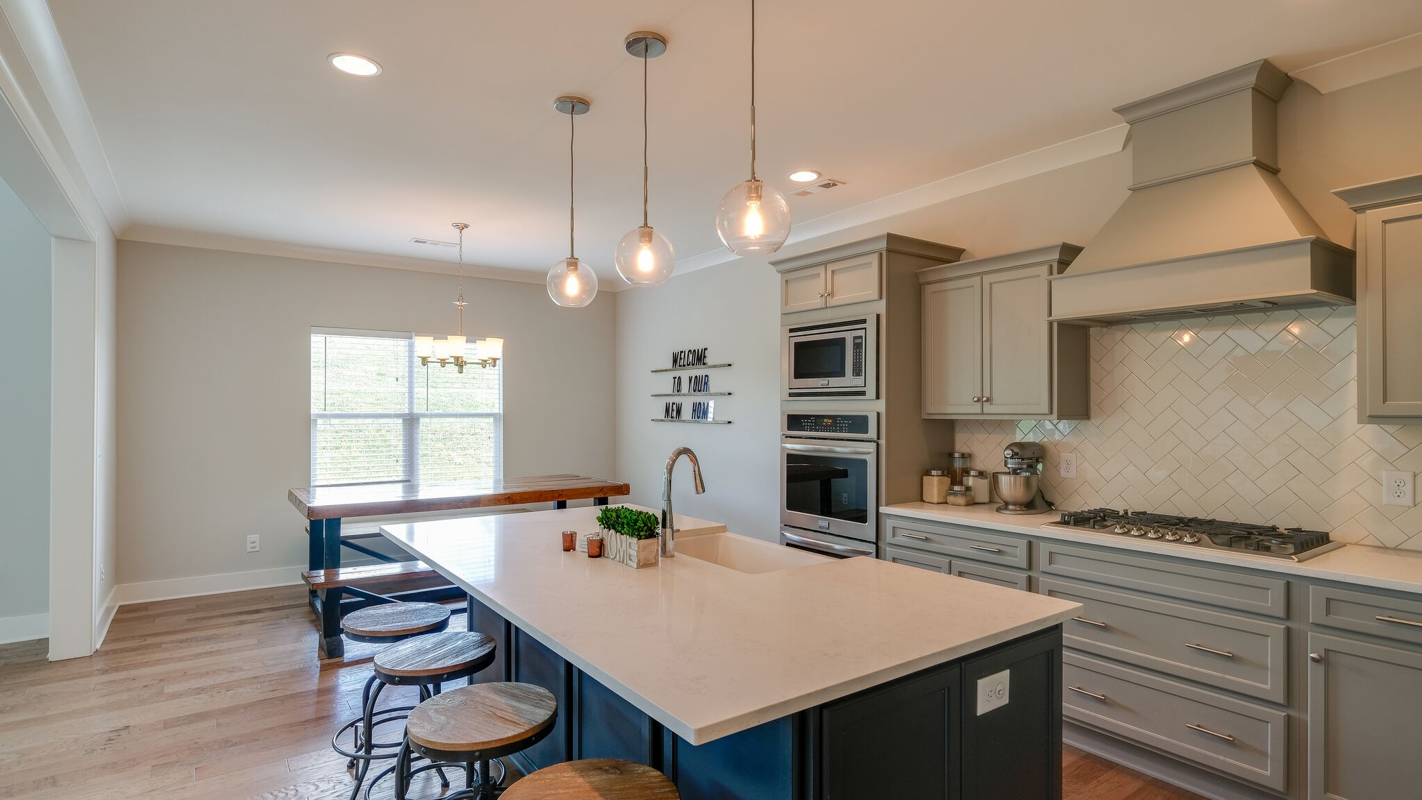 779 Plowson Road Mount Juliet, TN 37122 - Photo 12 of 44 a large kitchen with a table and chairs in it