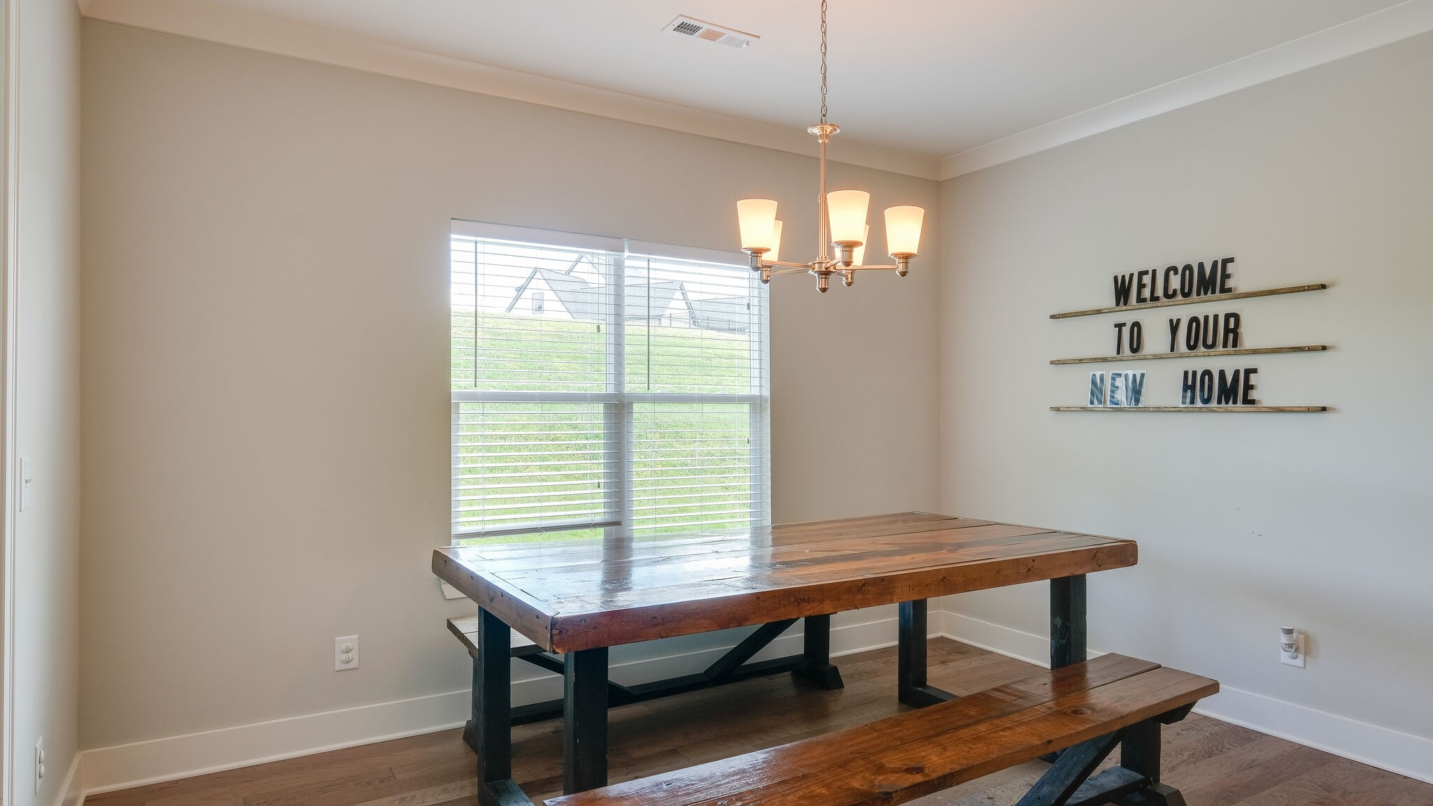 779 Plowson Road Mount Juliet, TN 37122 - Photo 15 of 44 a view of a room with a table chairs and wooden floor