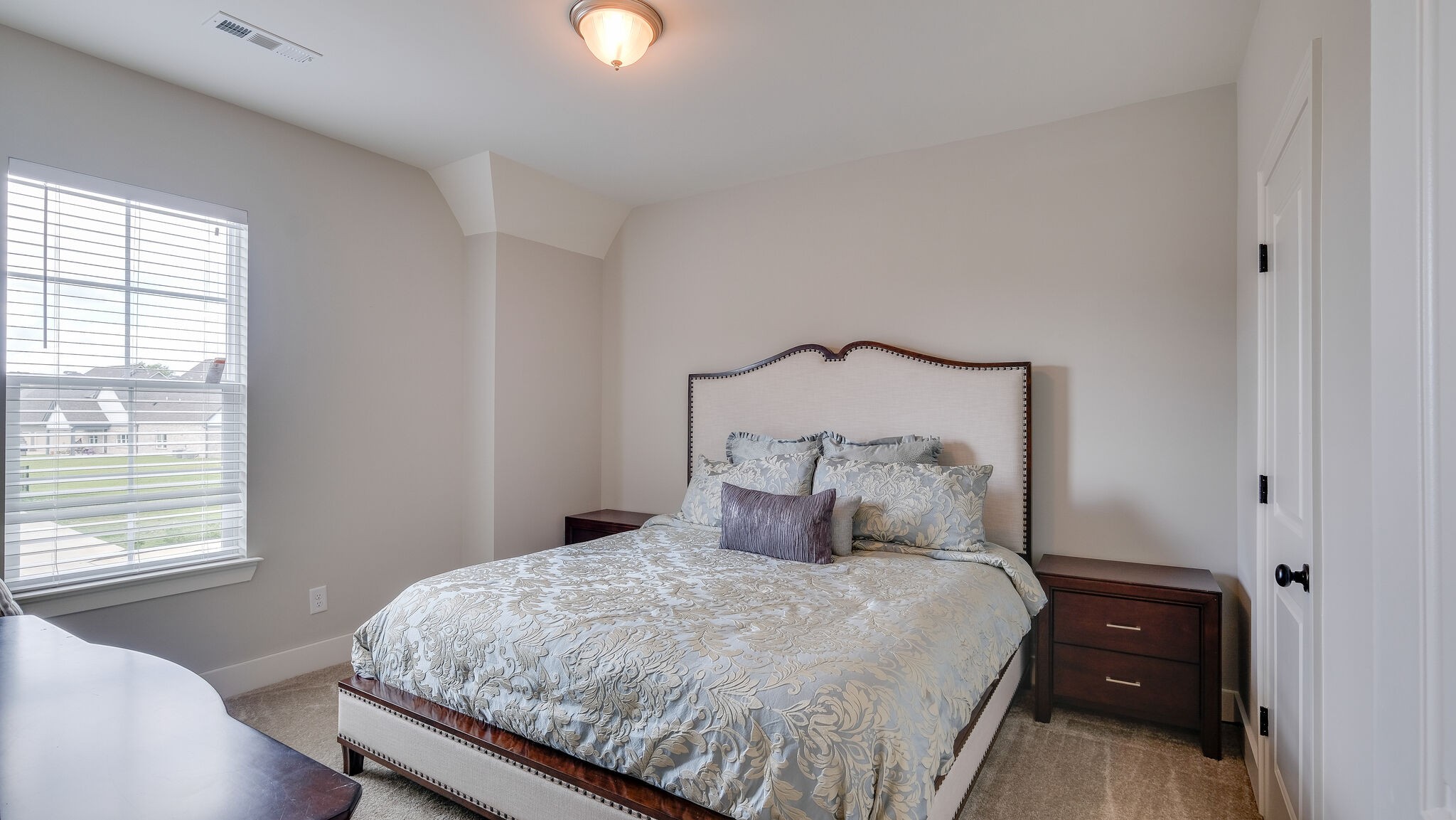 779 Plowson Road Mount Juliet, TN 37122 - Photo 24 of 44 a bedroom with a bed and window