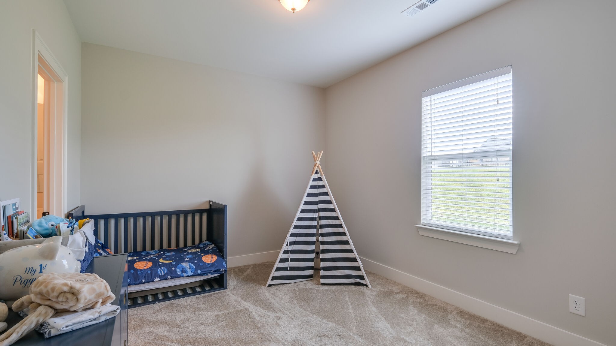 779 Plowson Road Mount Juliet, TN 37122 - Photo 27 of 44 a bedroom with furniture and a window