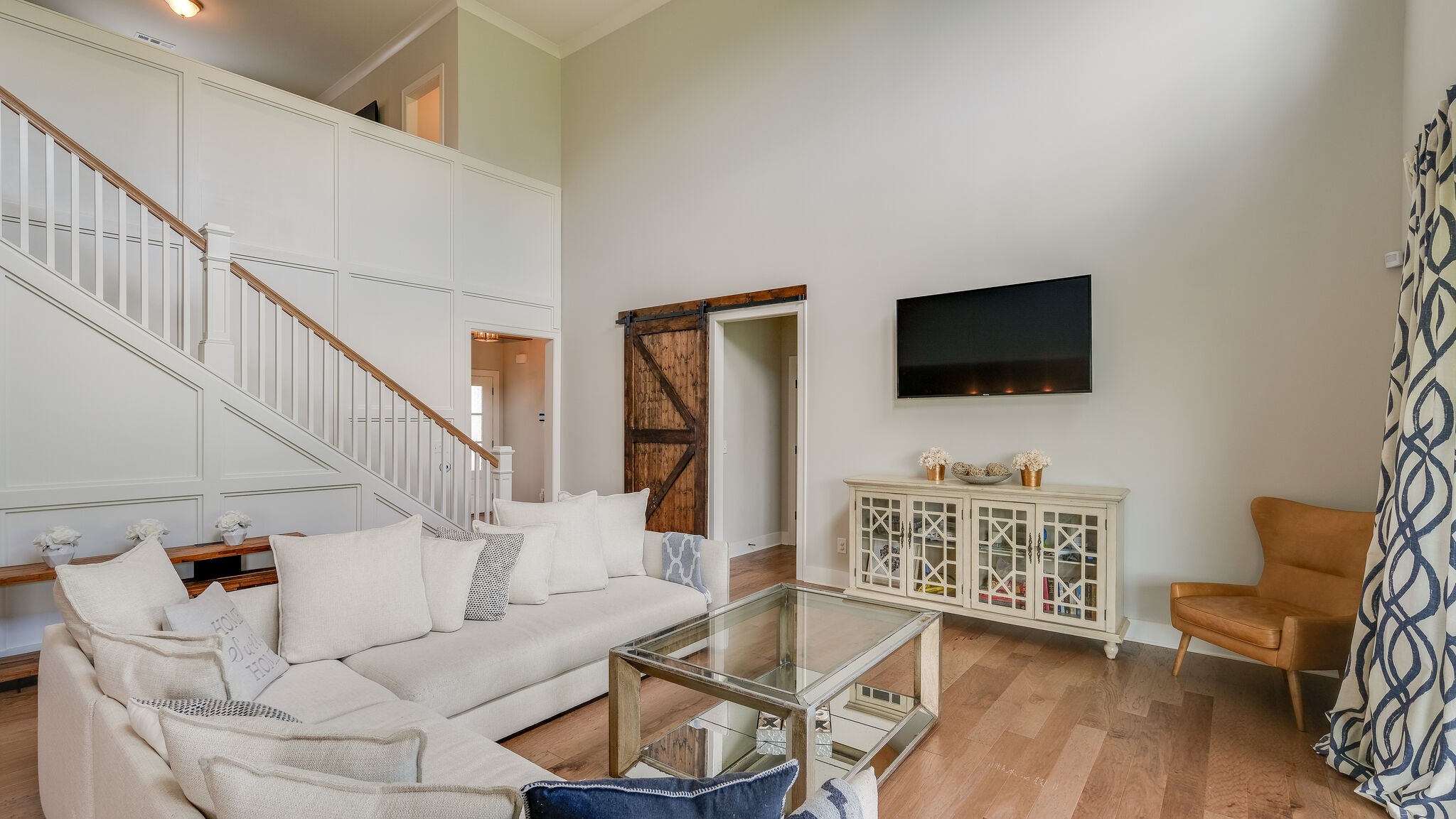 779 Plowson Road Mount Juliet, TN 37122 - Photo 10 of 44 a living room with furniture a flat screen tv and a wooden floor