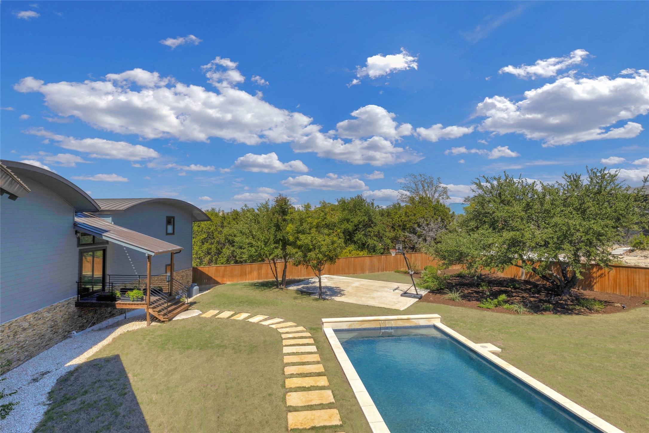 4227 Eck Lane Austin, TX 78734 - Photo 27 of 30 View of pool with a fenced backyard and a patio