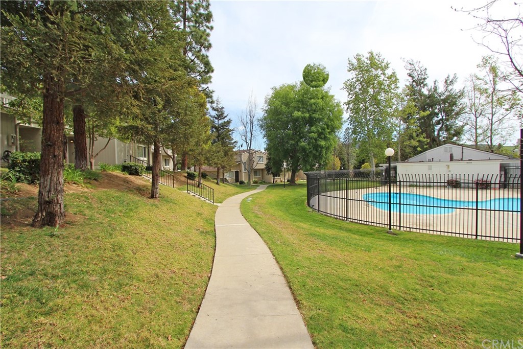 15030 Reedley Street, Unit C Moorpark, CA 93021 - Photo 22 of 23 a view of a swimming pool with a garden
