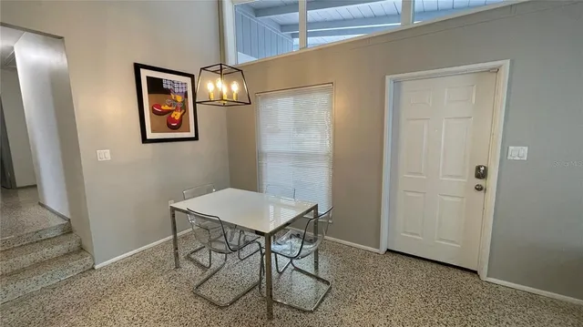 a view of a livingroom with furniture and windows