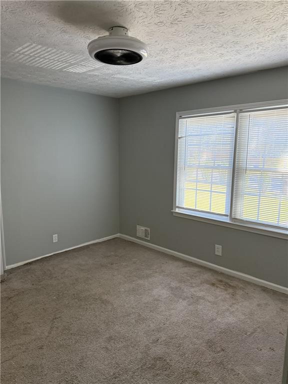 975 Ridgedale Drive Lawrenceville, GA 30043 - Photo 14 of 31 an empty room with a window