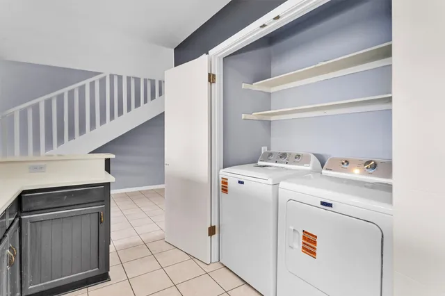 a utility room with dryer and washer