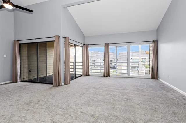a view of an empty room with a balcony