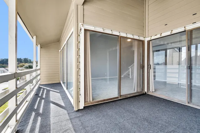 a view of hallway with windows