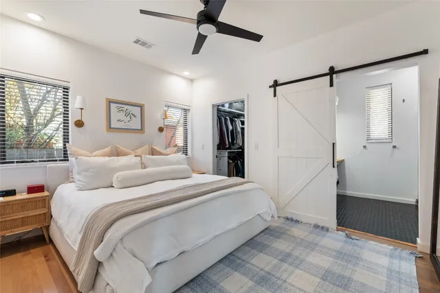 a bedroom with a bed and a walk in closet