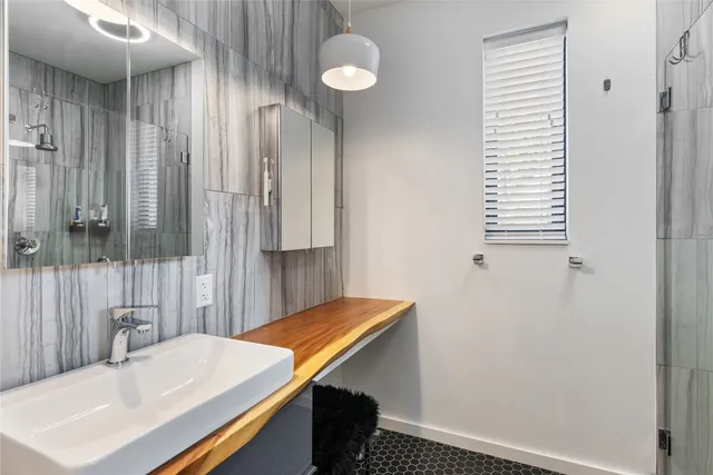a bathroom with a sink and a mirror