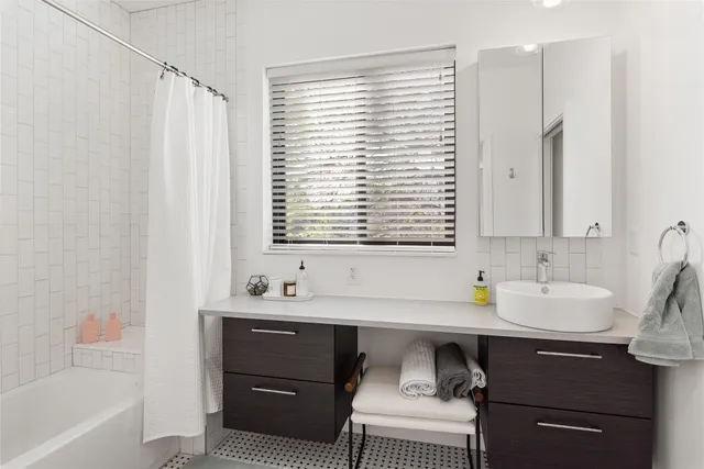 a bathroom with a sink and a bathtub