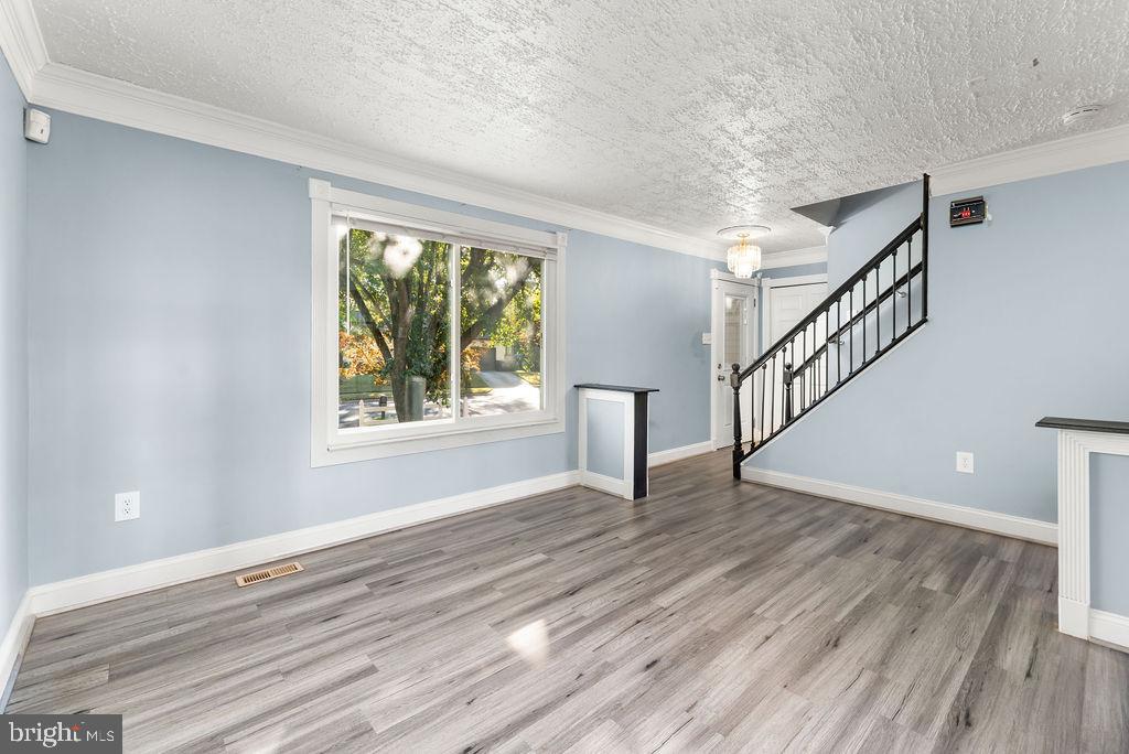 4924 Plata Street Clinton, MD 20735 - Photo 10 of 26 a view of an empty room with wooden floor and a window