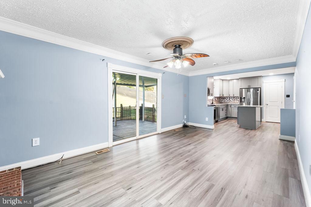 4924 Plata Street Clinton, MD 20735 - Photo 12 of 26 a view of a kitchen with a dishwasher cabinets and a wooden floor