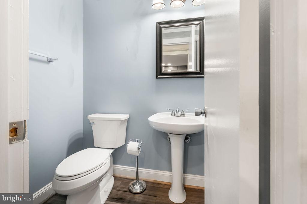 4924 Plata Street Clinton, MD 20735 - Photo 13 of 26 a bathroom with a sink toilet and a mirror