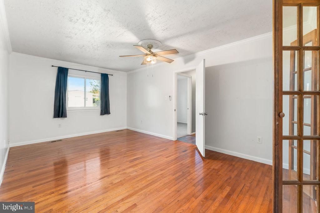 4924 Plata Street Clinton, MD 20735 - Photo 14 of 26 wooden floor in an empty room with a window