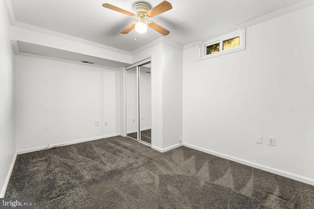 4924 Plata Street Clinton, MD 20735 - Photo 17 of 26 an empty room with a window and a fan