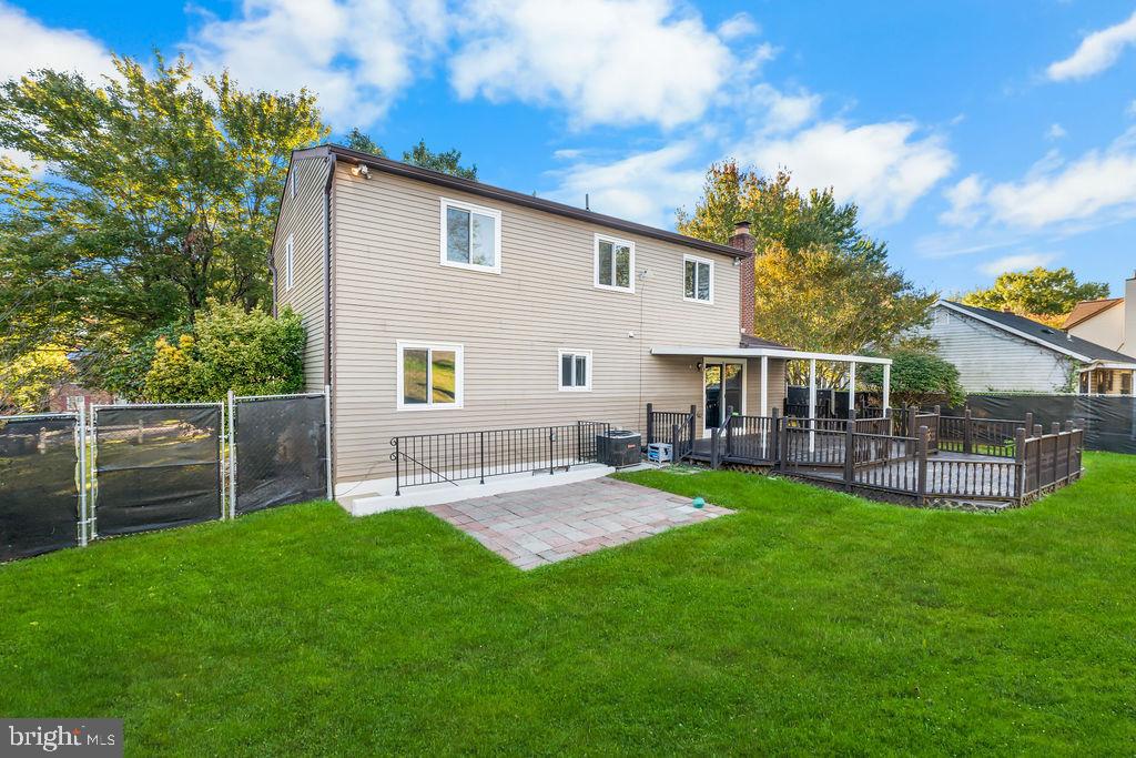 4924 Plata Street Clinton, MD 20735 - Photo 23 of 26 a view of a house with a yard and sitting area