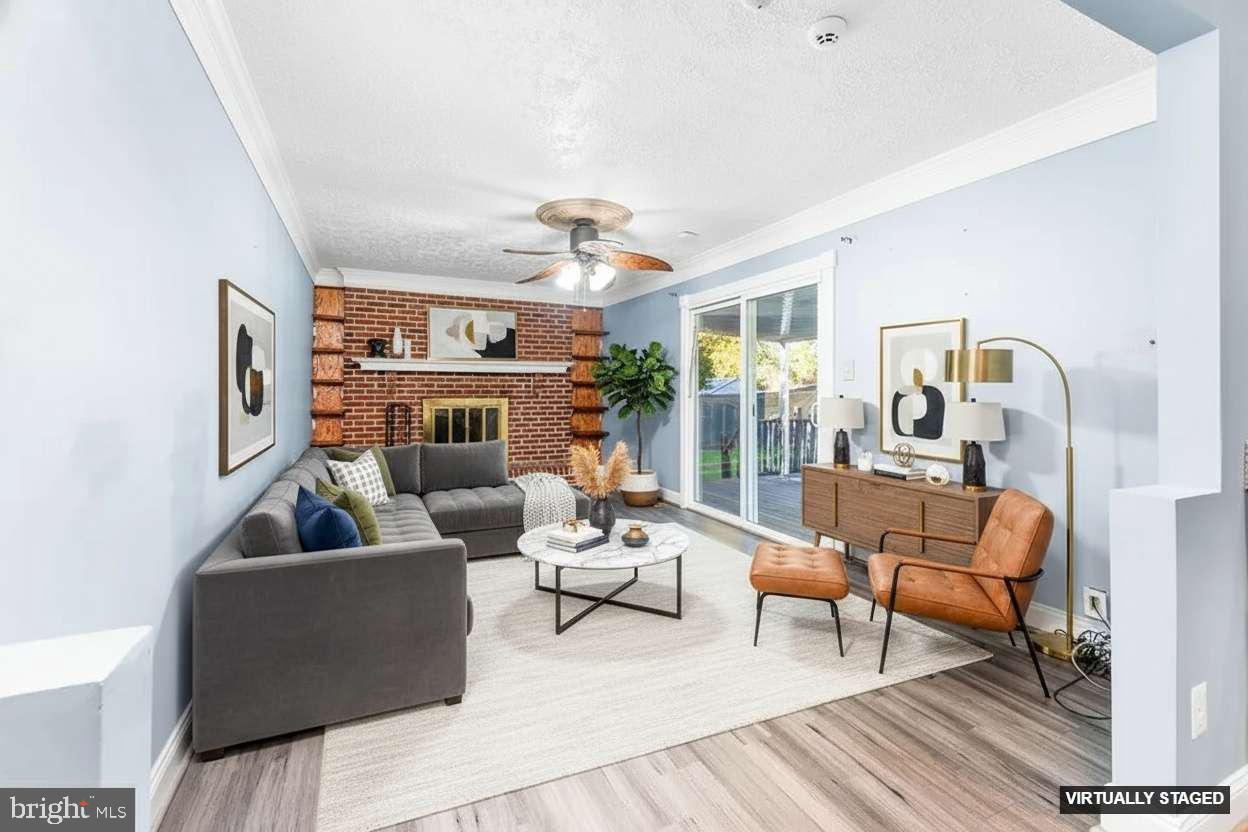 4924 Plata Street Clinton, MD 20735 - Photo 4 of 26 a living room with furniture and a fireplace