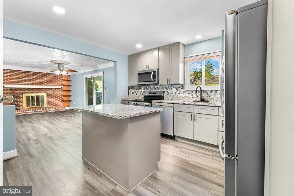 4924 Plata Street Clinton, MD 20735 - Photo 26 of 26 a kitchen with a sink stove and cabinets