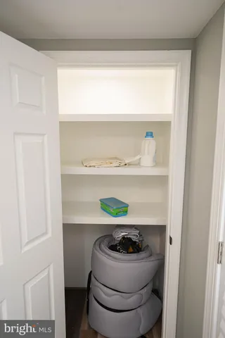 a room with a wooden floor and shoes