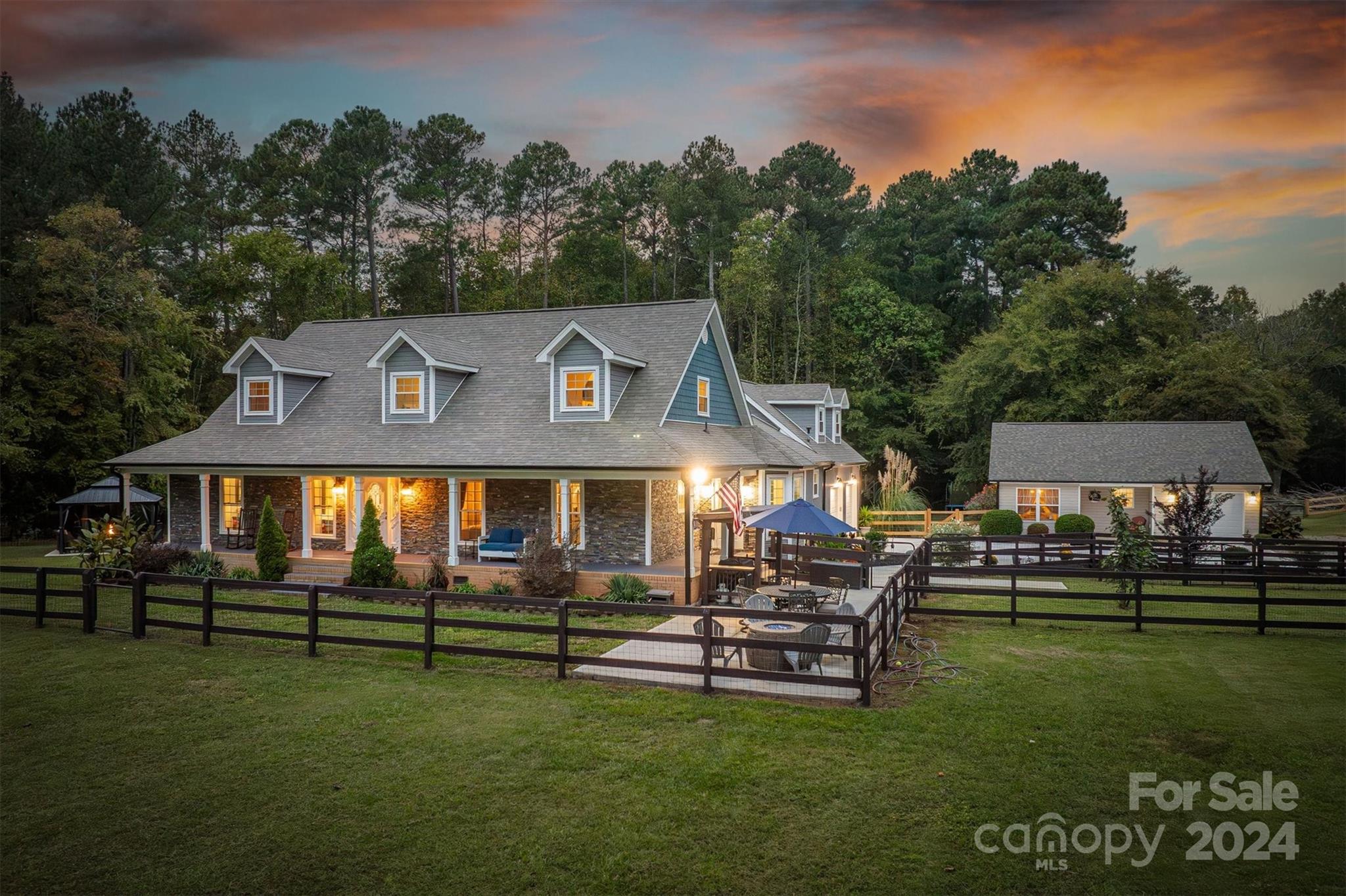 8800 Flowes Store Road Concord, NC 28025 - Photo 1 of 48 a front view of a house with a garden