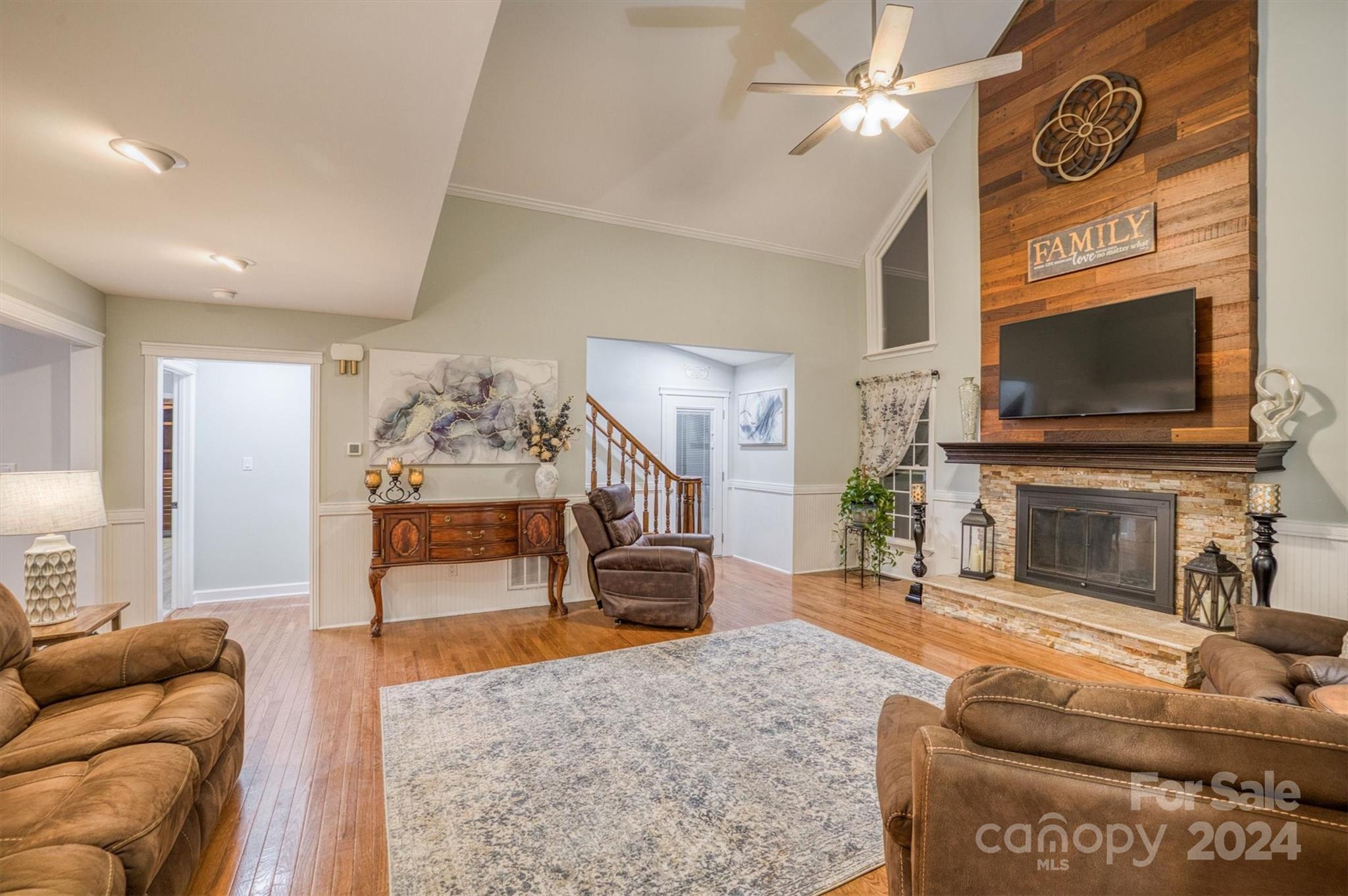 8800 Flowes Store Road Concord, NC 28025 - Photo 12 of 48 a living room with furniture and a flat screen tv