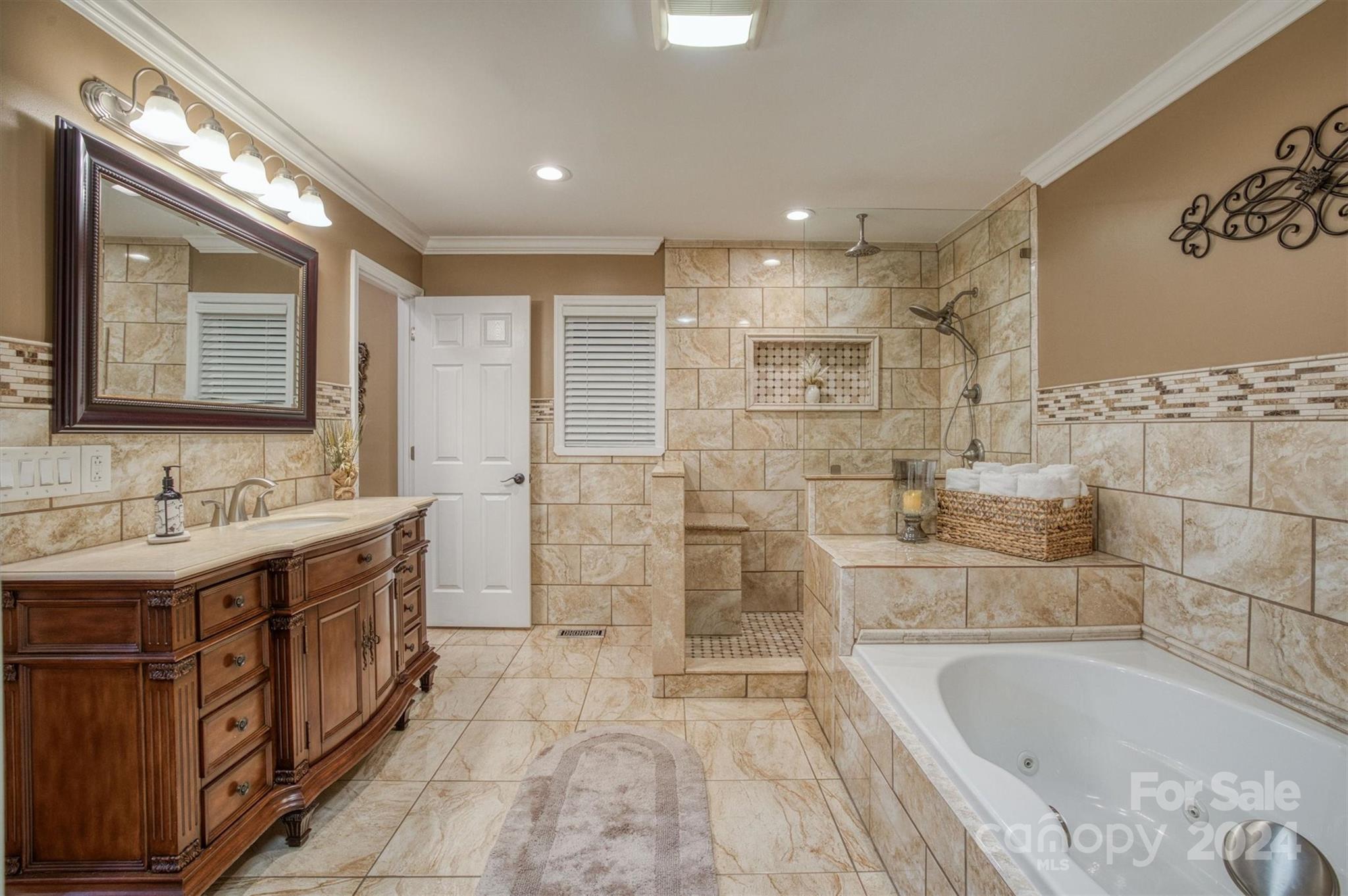 8800 Flowes Store Road Concord, NC 28025 - Photo 18 of 48 a bathroom with a tub sink shower and mirror