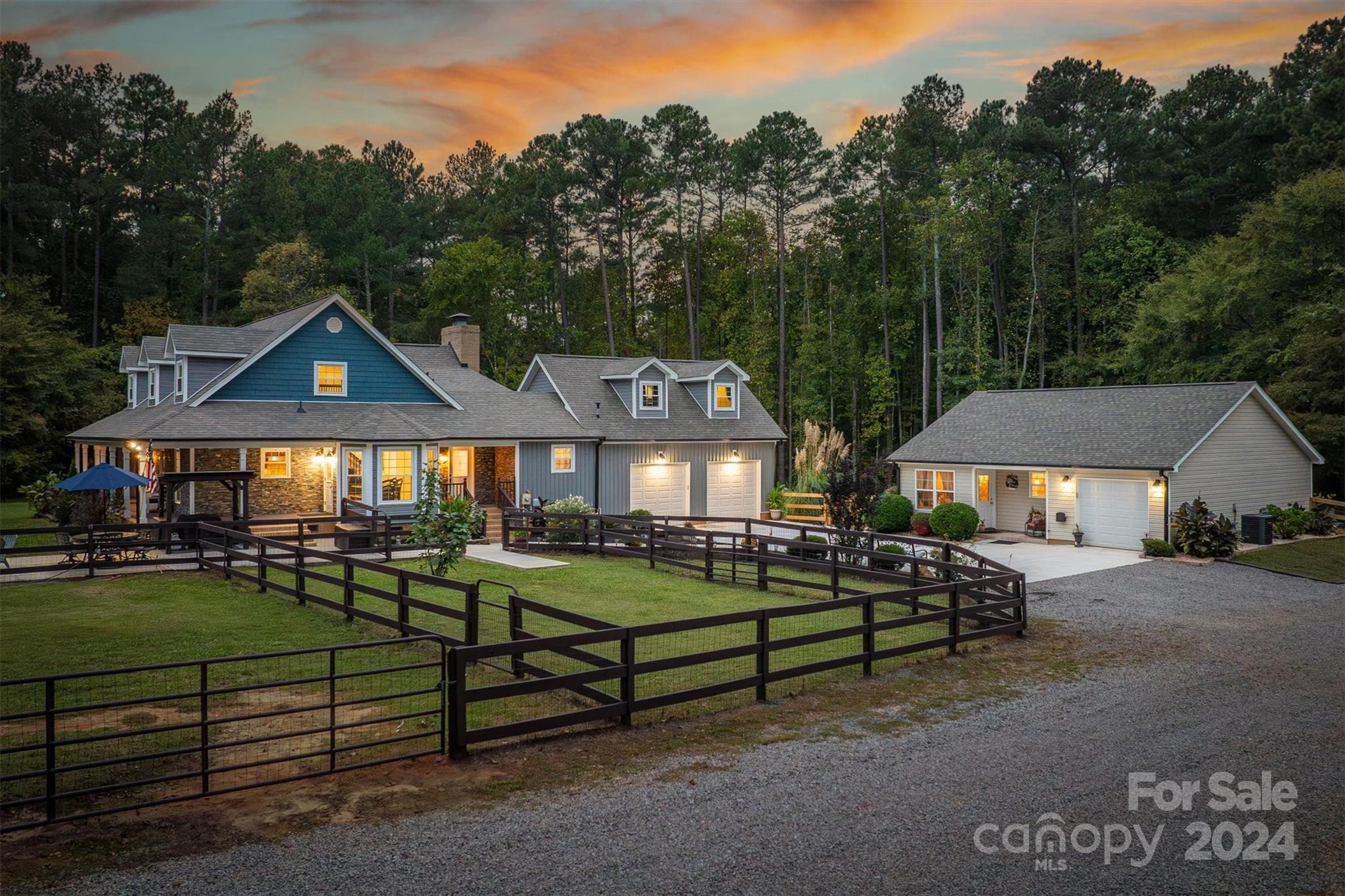 8800 Flowes Store Road Concord, NC 28025 - Photo 2 of 48 a front view of a house with garden