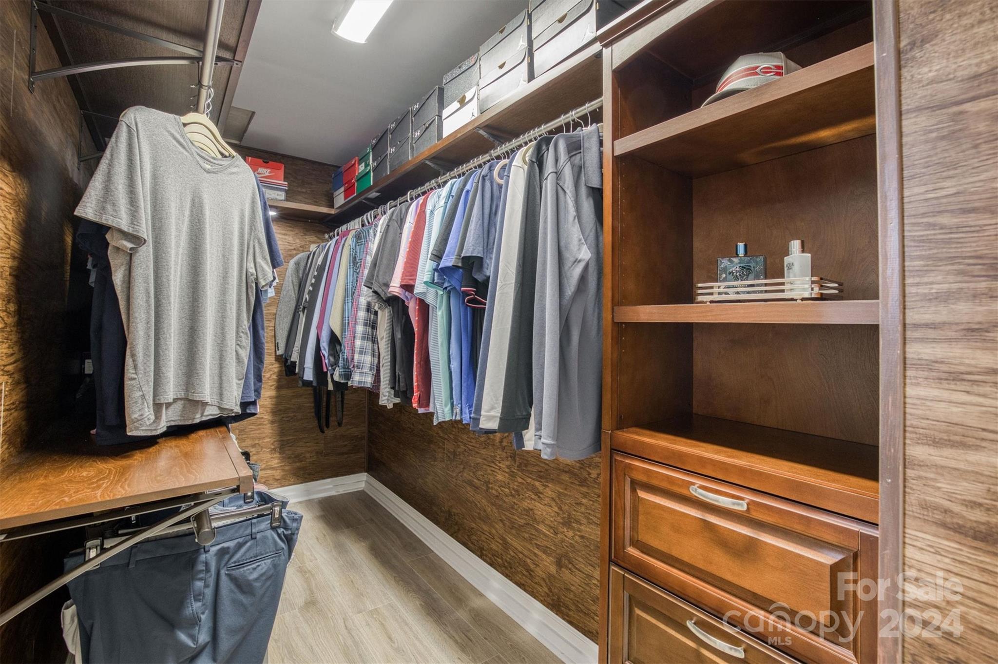 8800 Flowes Store Road Concord, NC 28025 - Photo 21 of 48 a view of walk in closet with clothes and shoes