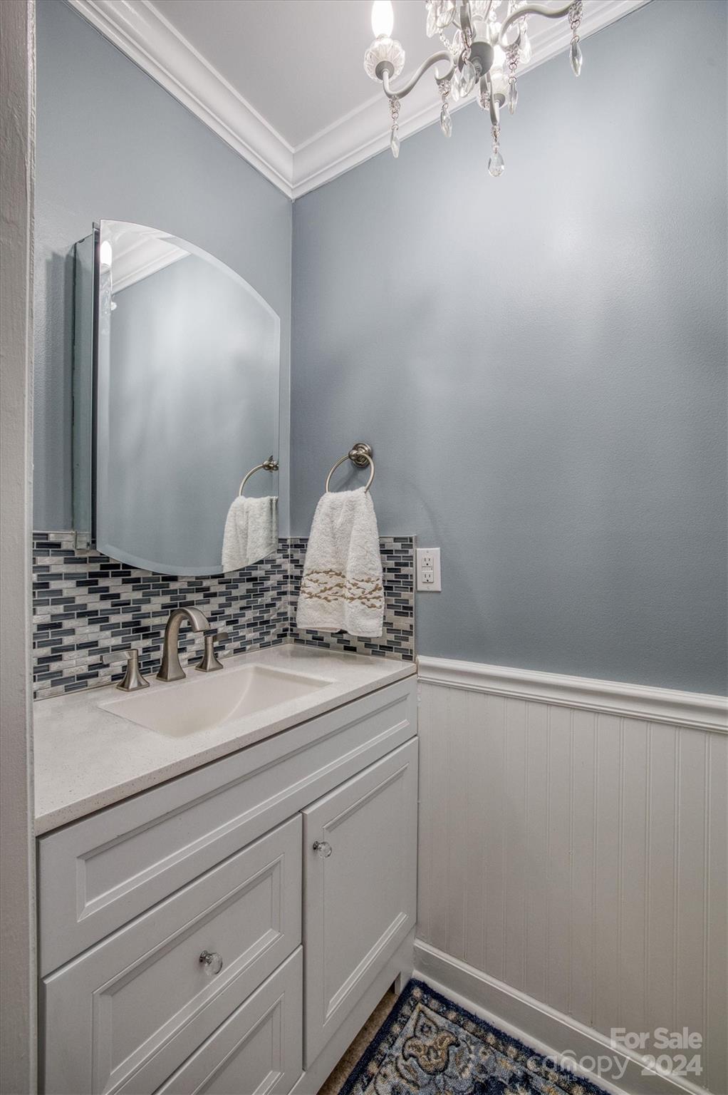8800 Flowes Store Road Concord, NC 28025 - Photo 25 of 48 a bathroom with a sink and a mirror