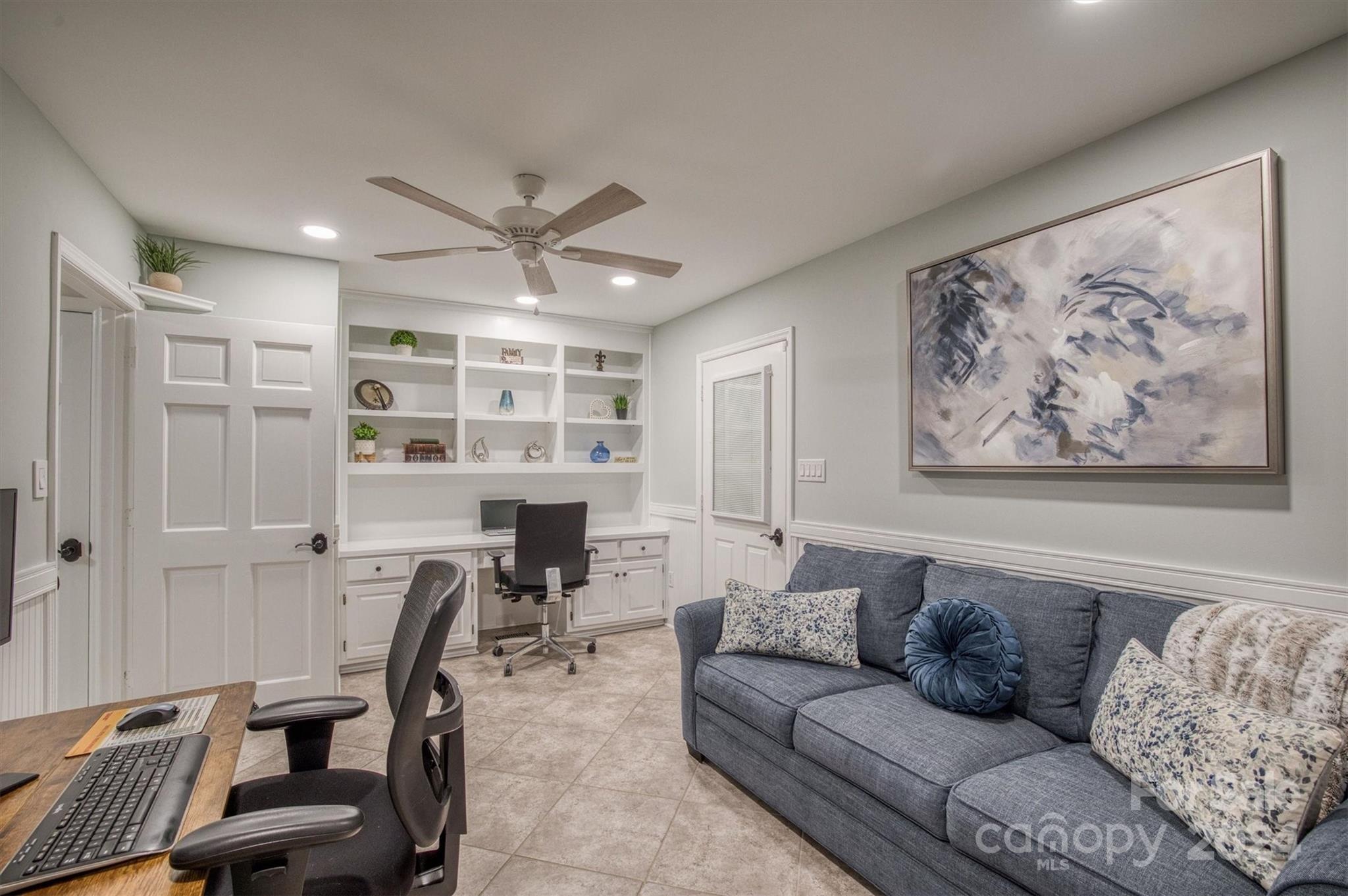 8800 Flowes Store Road Concord, NC 28025 - Photo 26 of 48 a living room with furniture and a chandelier