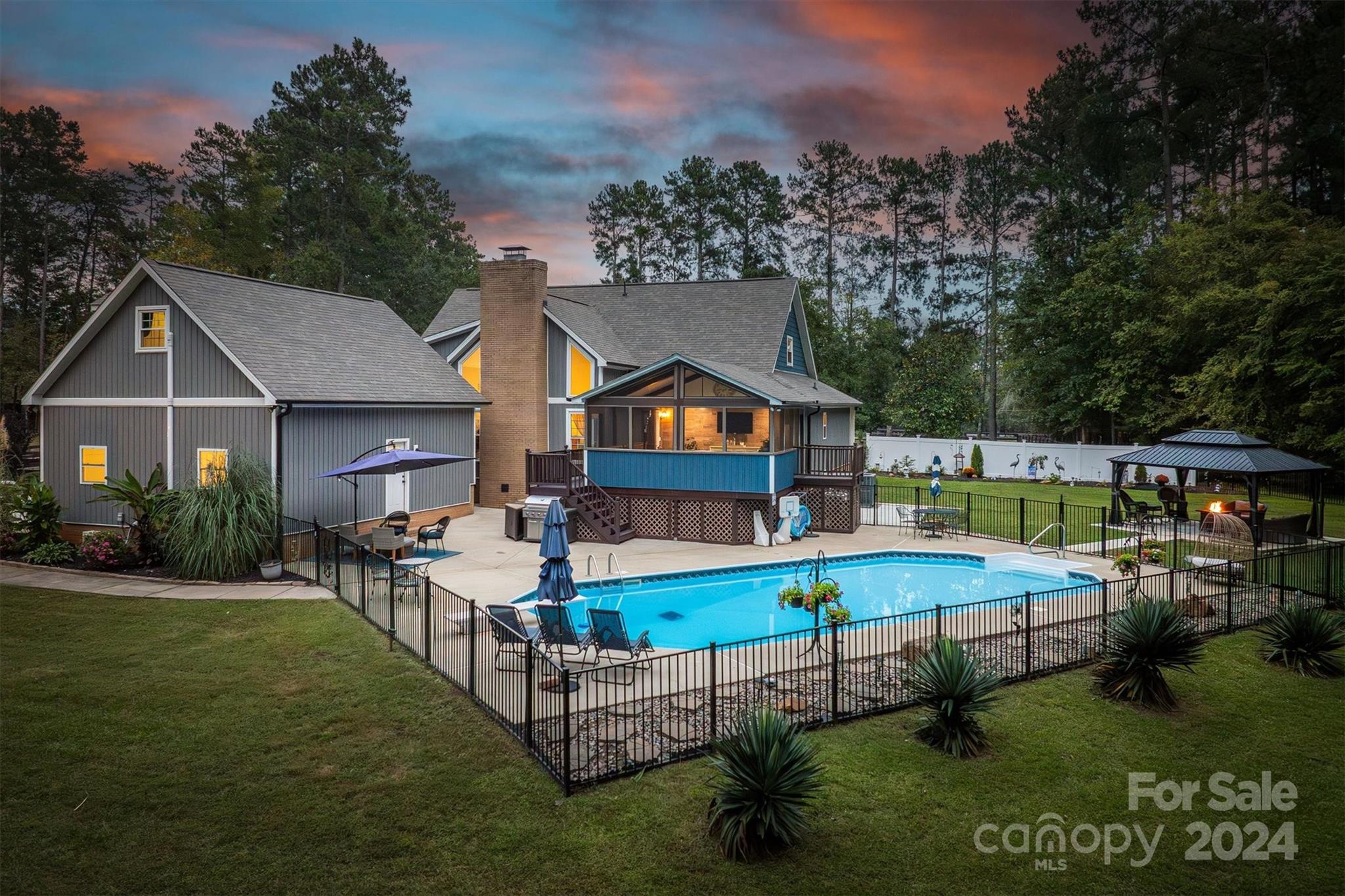 8800 Flowes Store Road Concord, NC 28025 - Photo 3 of 48 a aerial view of a house with swimming pool and yard