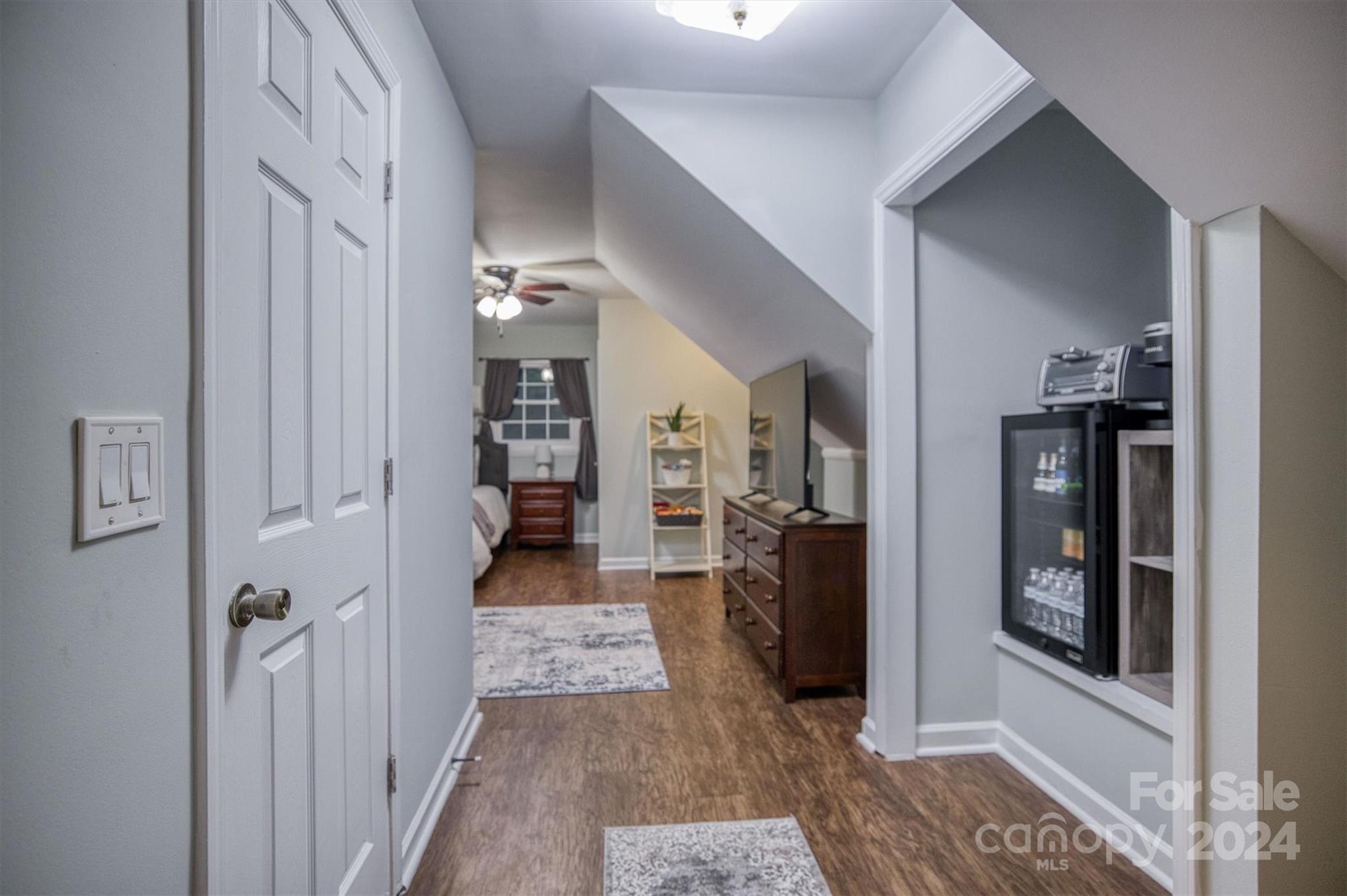 8800 Flowes Store Road Concord, NC 28025 - Photo 31 of 48 a view of a hallway with wooden floor and windows