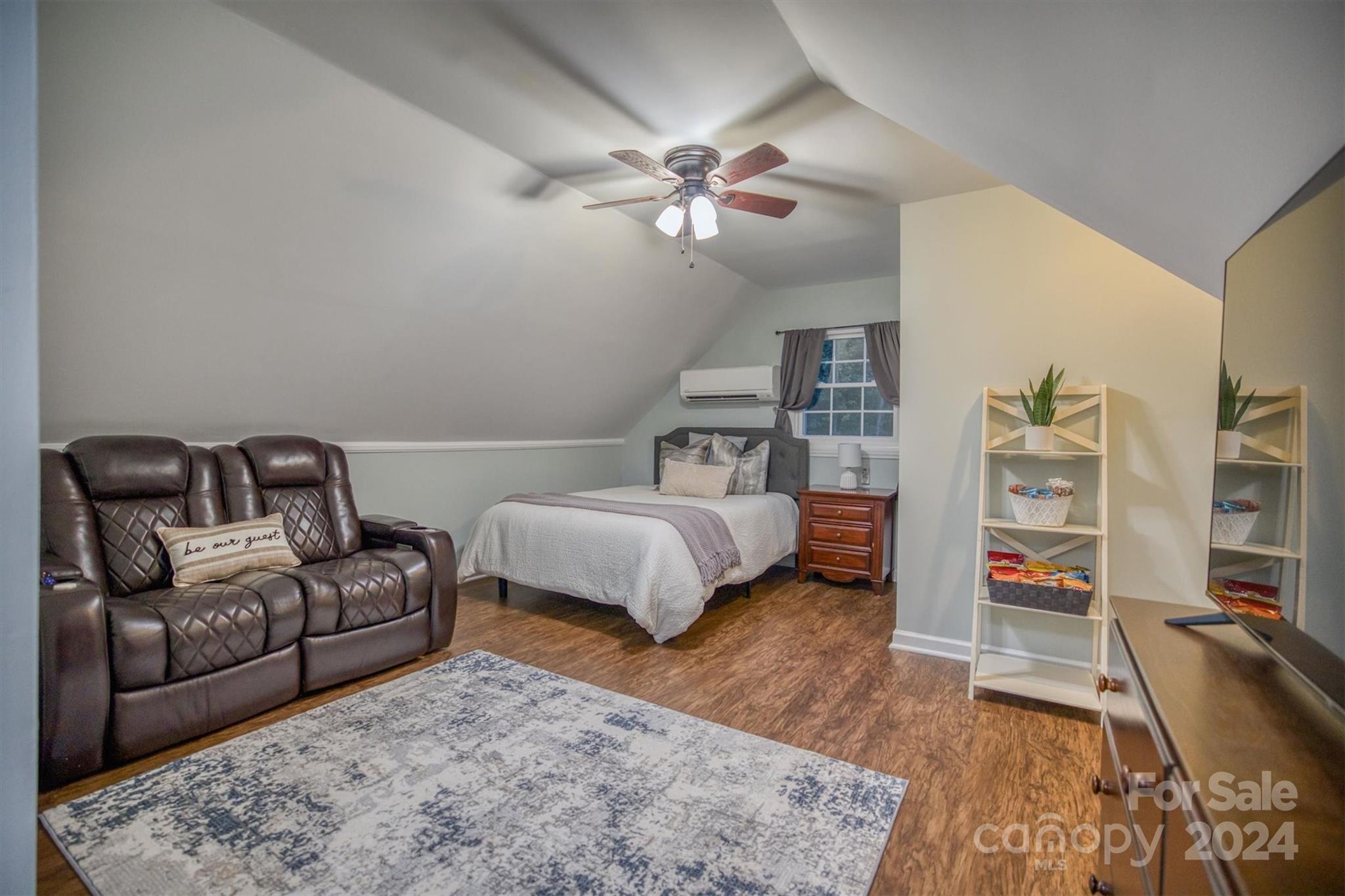 8800 Flowes Store Road Concord, NC 28025 - Photo 32 of 48 a living room with furniture and a flat screen tv