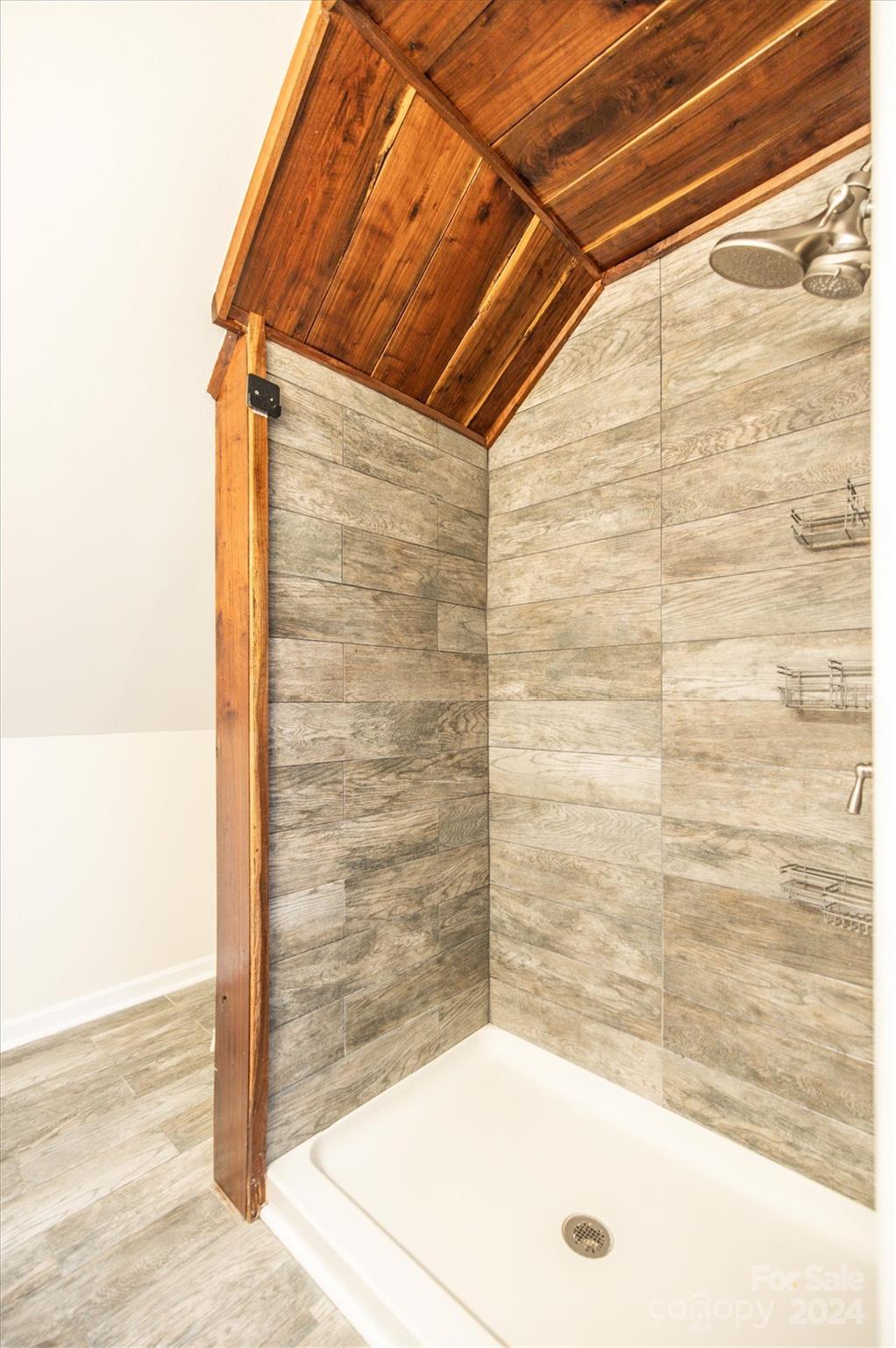 8800 Flowes Store Road Concord, NC 28025 - Photo 34 of 48 a bathroom with a bathtub and shower