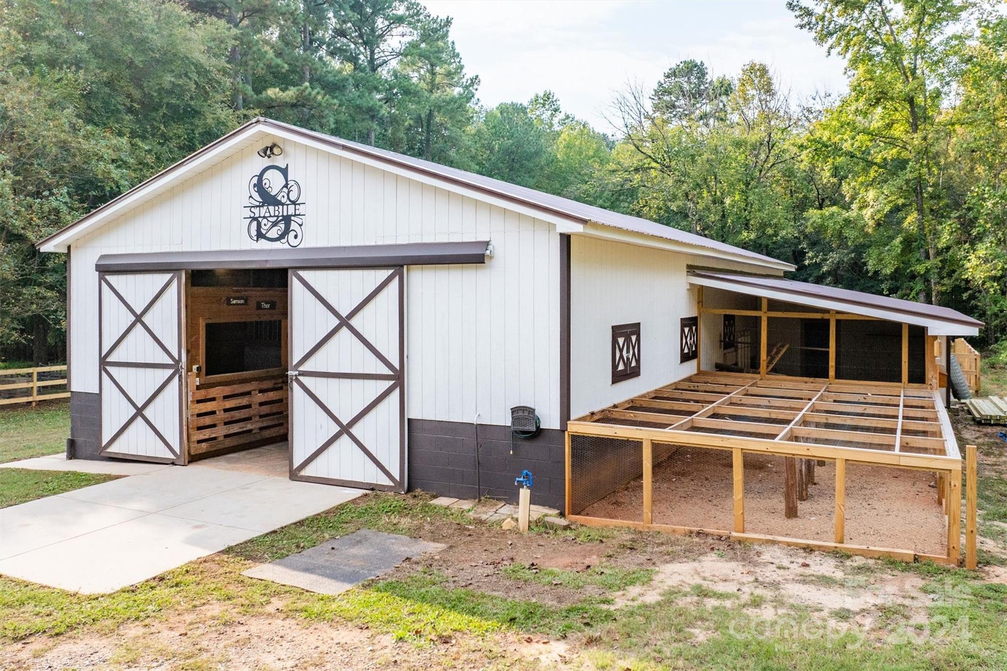 8800 Flowes Store Road Concord, NC 28025 - Photo 7 of 48 a view of house with a outdoor space
