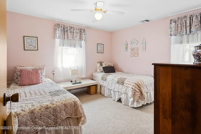 a bedroom with a bed and a table in it