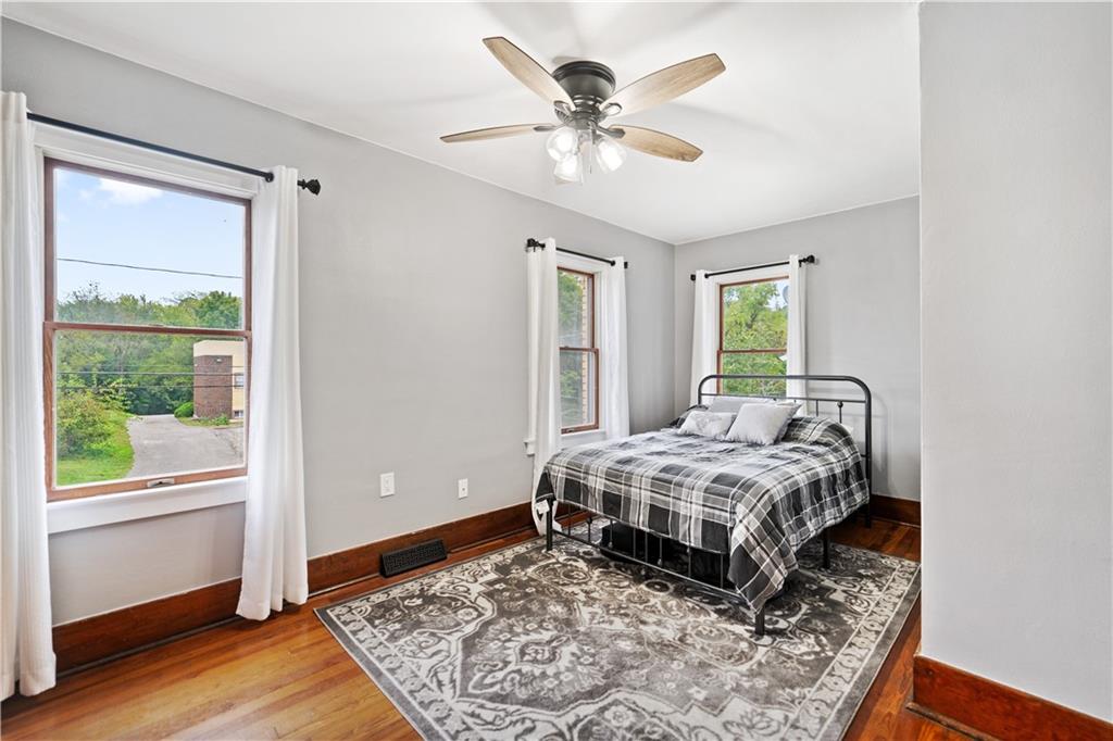 583 Adams Street Rochester, PA 15074 - Photo 20 of 35 a bedroom with a large bed and a window