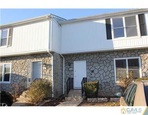 4407 Hana Road Edison, NJ 08817 - Photo 1 of 10 a front view of a house with garden