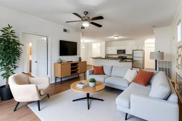 a living room with furniture and a flat screen tv