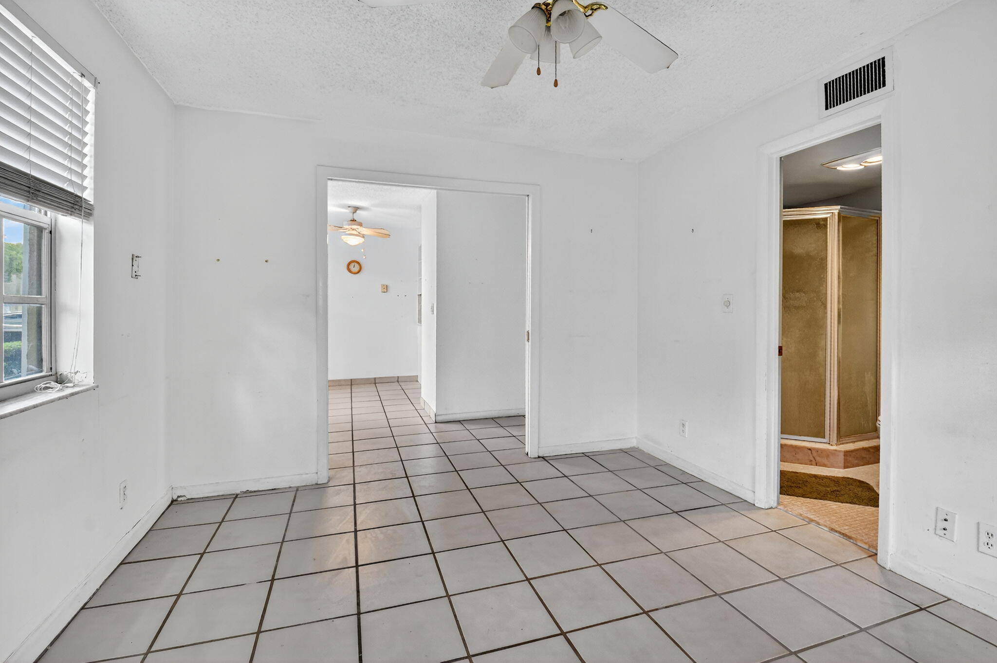 13682 Vía Flora, Unit D Delray Beach, FL 33484 - Photo 20 of 27 a view of an empty room and window