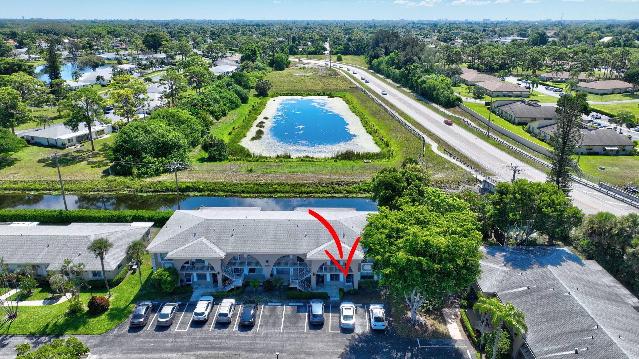 13682 Vía Flora, Unit D Delray Beach, FL 33484 - Photo 23 of 27 an aerial view of a city