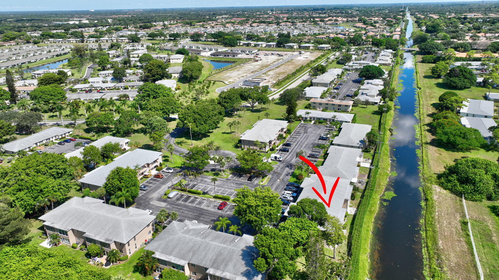 13682 Vía Flora, Unit D Delray Beach, FL 33484 - Photo 24 of 27 an aerial view of residential houses with outdoor space