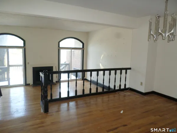 a view of entryway with wooden floor